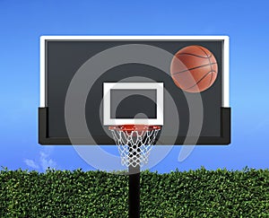 A player throws a basketball towards the net and trying to get a score