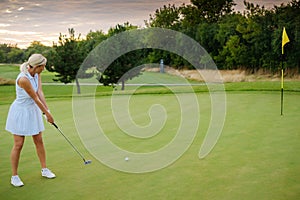 Player Woman Hit Ball Into Golf Tee .