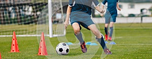 Players Practice Soccer Dribbling Skills on Training Venue. Football Drills on School Soccer Training