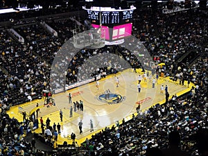 Players shoot around to warm-up during halftime