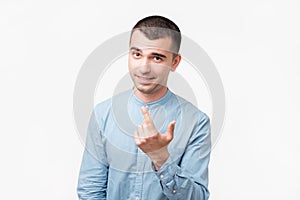 Playful adult showing come here gesture with index finger and smiling