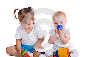Playful babies playing with toys