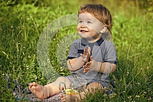 Playful baby boy on grass