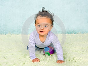 Playful baby crawling