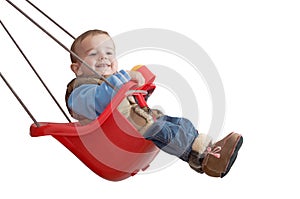 Playful baby in a swing