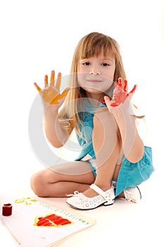 Playful beauty girl with many-coloured hands