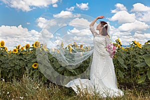 Playful bride in sunflower field