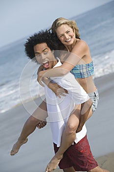 Playful Couple On Beach