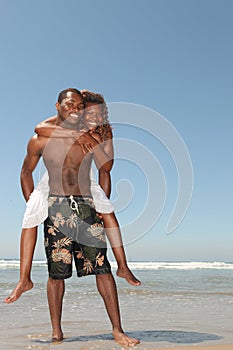 Playful Couple on the Beach in the Ocean Water