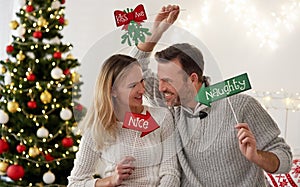 Playful couple celebrating Christmas