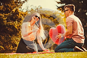 Playful couple in park.