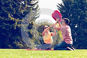 Playful couple in park.