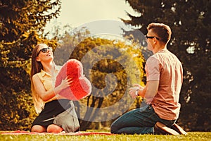 Playful couple in park.