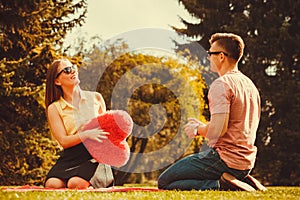 Playful couple in park.