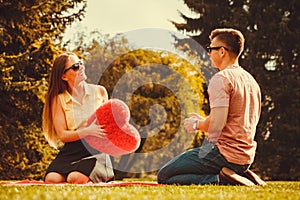 Playful couple in park.