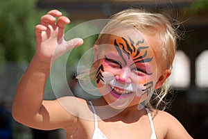 Playful face painted child