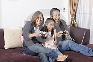 Playful family playing video games