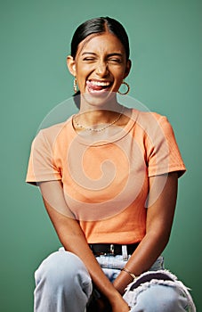 Playful, fun and portrait of a woman with tongue out isolated on a green screen or studio background. Happy, goofy and a