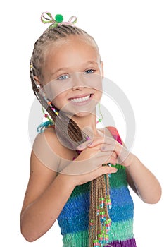 Playful girl holding her dreadlocks
