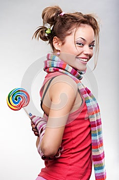 Playful girl with lollipop