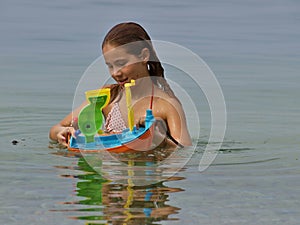 Playful girl in the sea photo