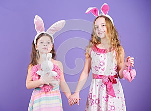 Playful girls sisters celebrate easter. Spring holiday. Happy childhood. Easter day. Easter activities for children