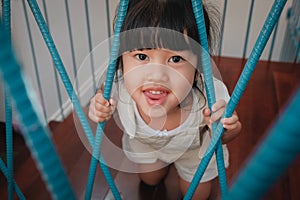 Playful Kids. Childhood Concept. Little Cute 3-4 Years Old Girl in Happiness Moment. Children Playing in House