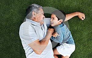 Playful, laughing and grandfather and child in a garden for happiness, playing and cheerful together. Babysit, happy and