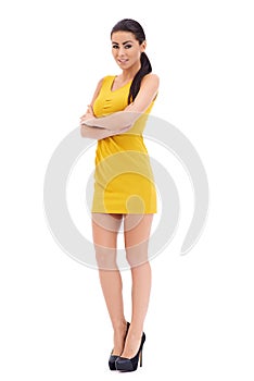 Playful leggy model posing on white photo