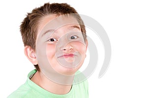 Playful mischievous young boy photo