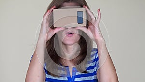 Playful smiling woman using vr virtual reality glasses. closeup
