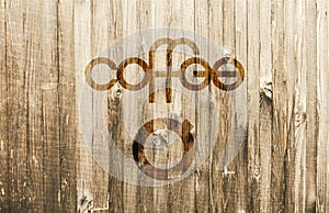 Playful Lettering Coffee with a Simple Stylized Coffee Cup on Wooden Background