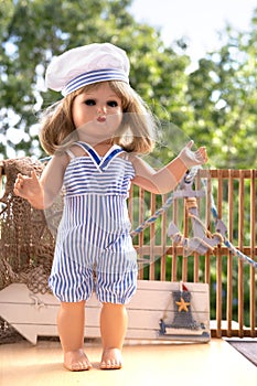 playful toy doll in swimsuit, day of fun in sun, carefree spirit summer vacation and joy of childhood, traveling with children,