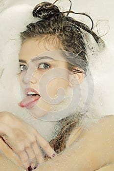 Playful woman in bath
