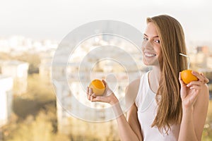 Playful woman drinking orange juice