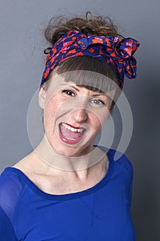 Playful woman with fifties hairstyle enjoying shouting