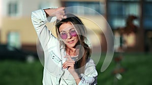 Playful woman street dancer dancing at summer sunny downtown. Medium close up shot on 4k RED camera