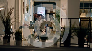 Playful worker jesting with colleague photo