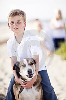 Playful Young Boy with His Dog Outdoors photo