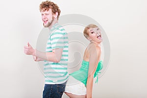 Playful young couple blonde girl bearded man