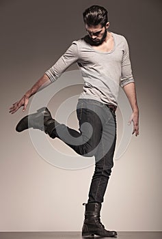 Playful young fashion model in a dynamic pose