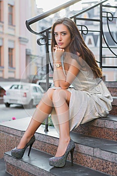 Playful young lady posing on the street