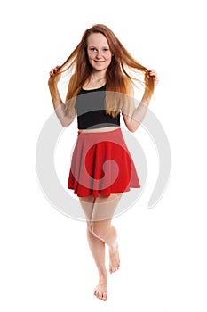 Playful young woman in mini skirt