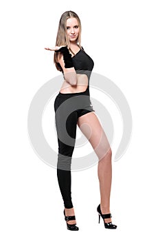 Playful young woman in skintight black costume photo