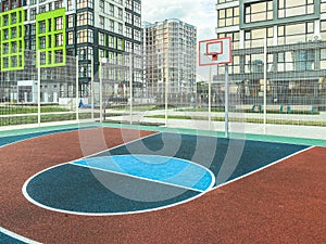 Playground for basketball. anti-slip coating for a sports field made of rubberized material. on the court there is a ball ring.