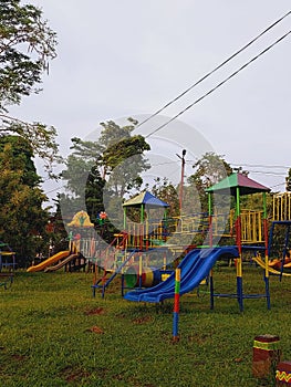 A playground for children on green grass and bluesky backgound photo