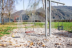 Playground for children, swings on the street.