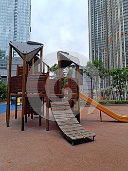 Playground in the city near skycraper photo