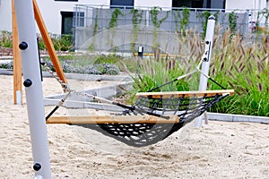 Playground with a hammock close-up in cozy courtyard of modern residential district