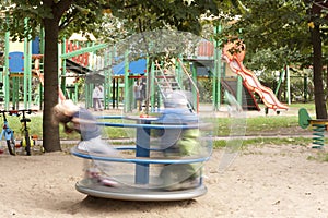 Playground with kids and carousel